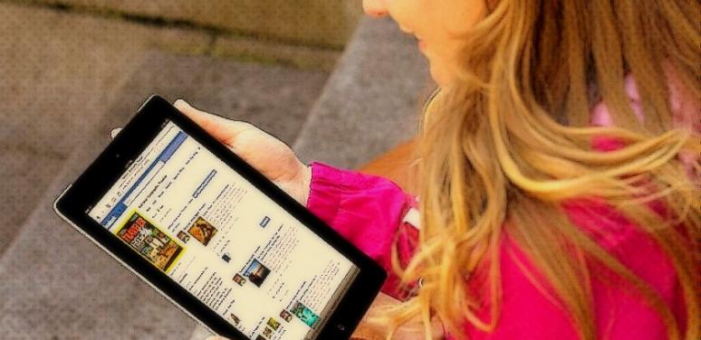 woman looking at her tablet